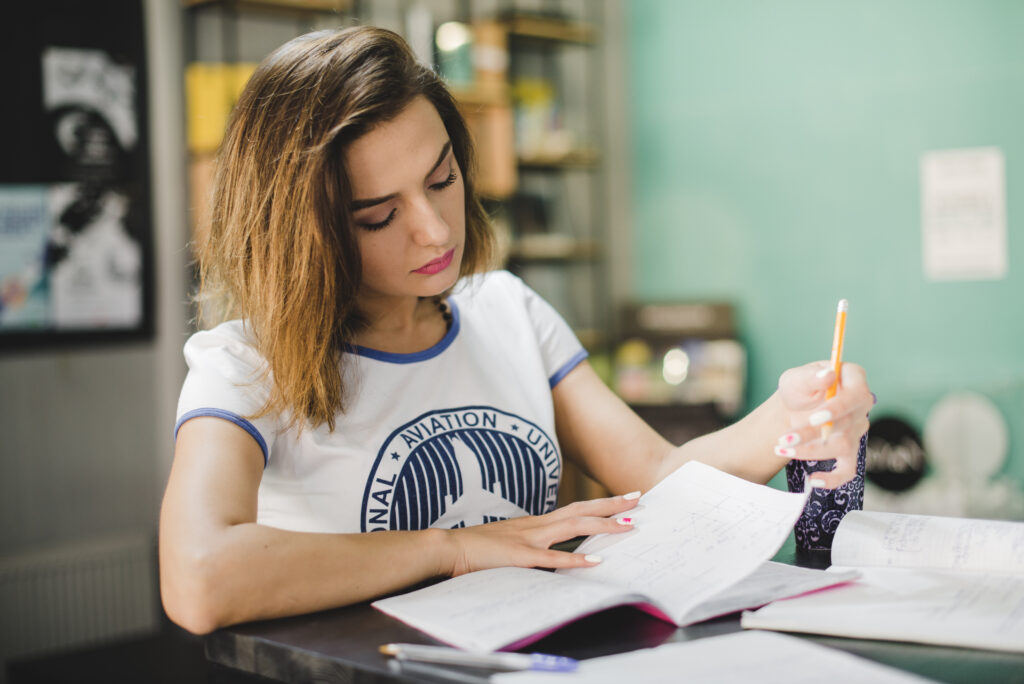 Girl sitting in the table studying