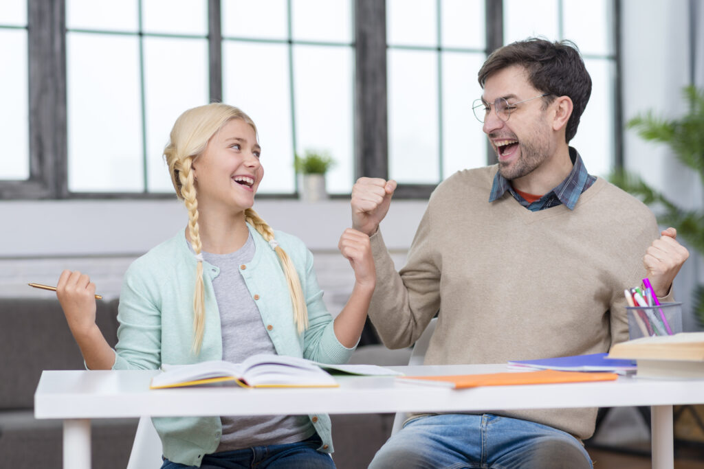 Teacher and Student cheering